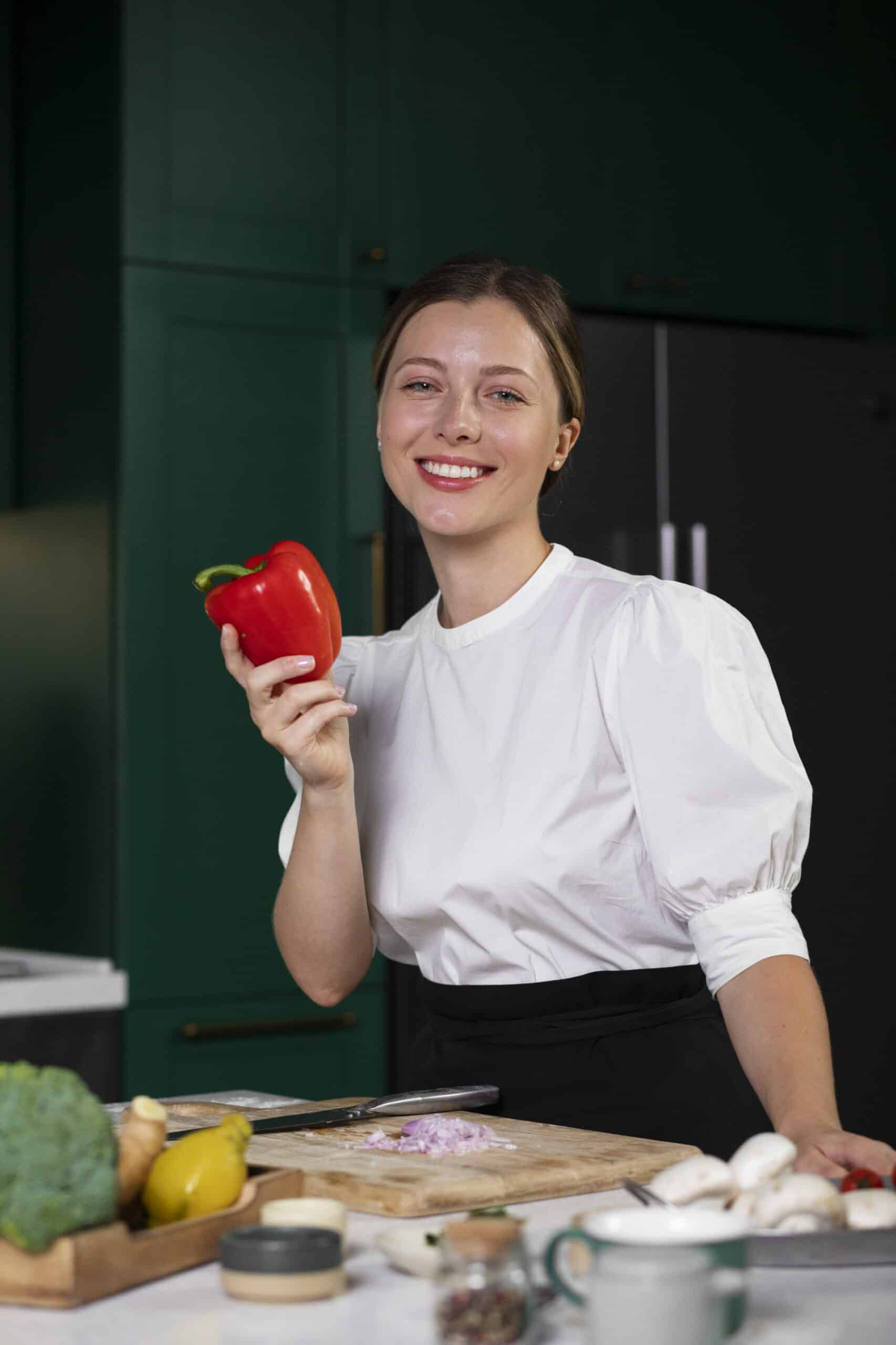 Annie-smiley-woman-holding-pepper Annie